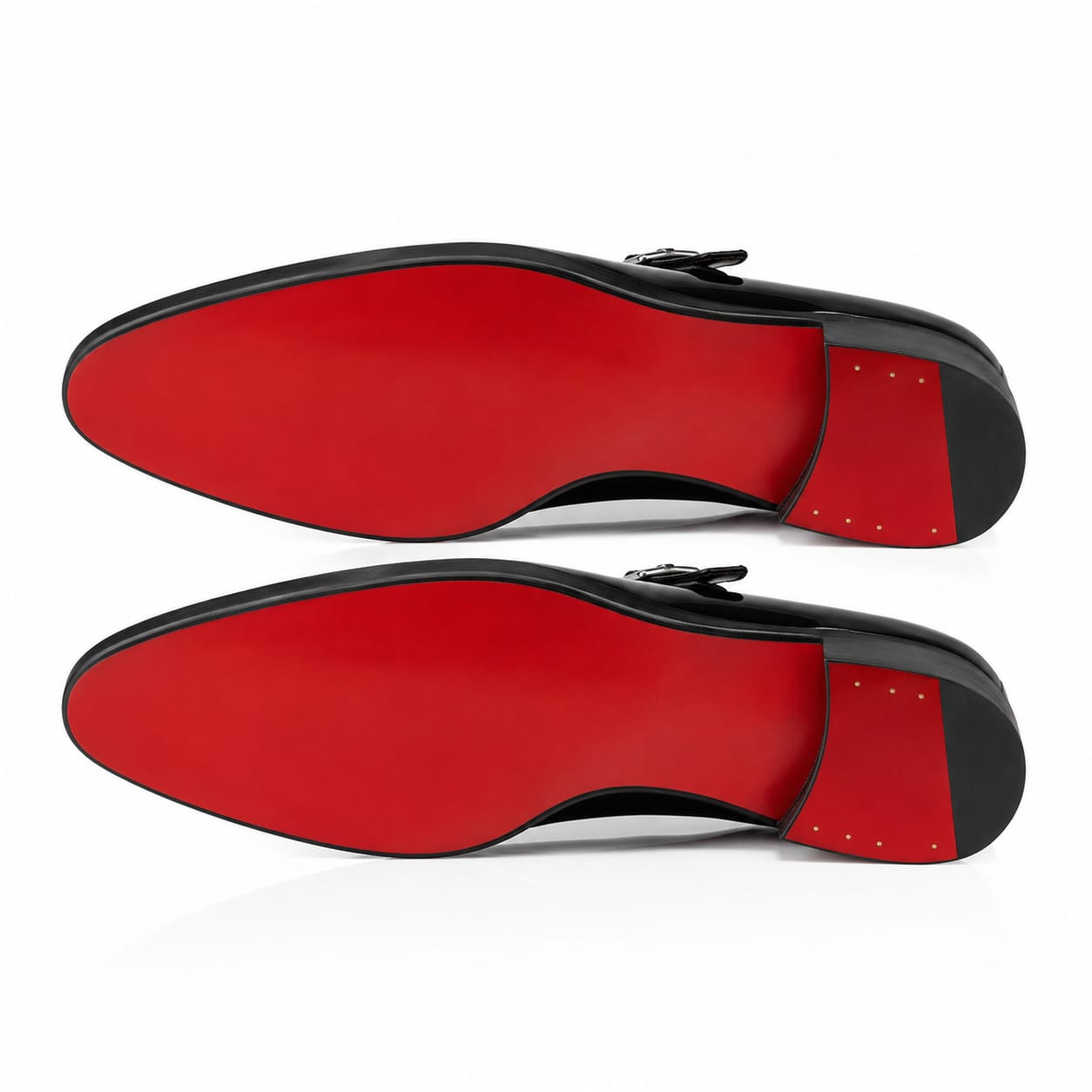 A pair of black leather dress shoes shown from the sole, featuring a vibrant red insole and a black outsole.
